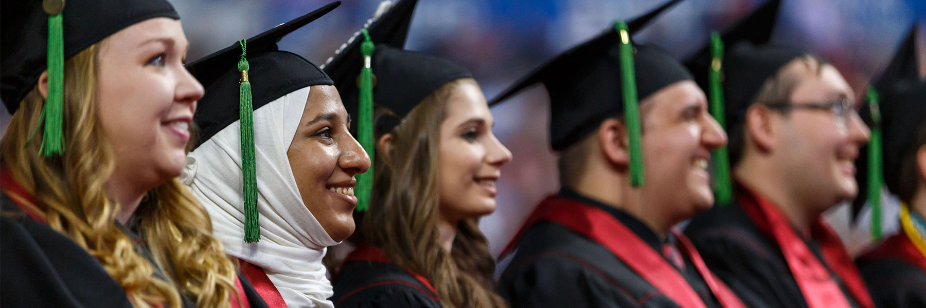 Profile view of a row of four students at IU Indianapolis (Formerly IUPUI) Graduation.