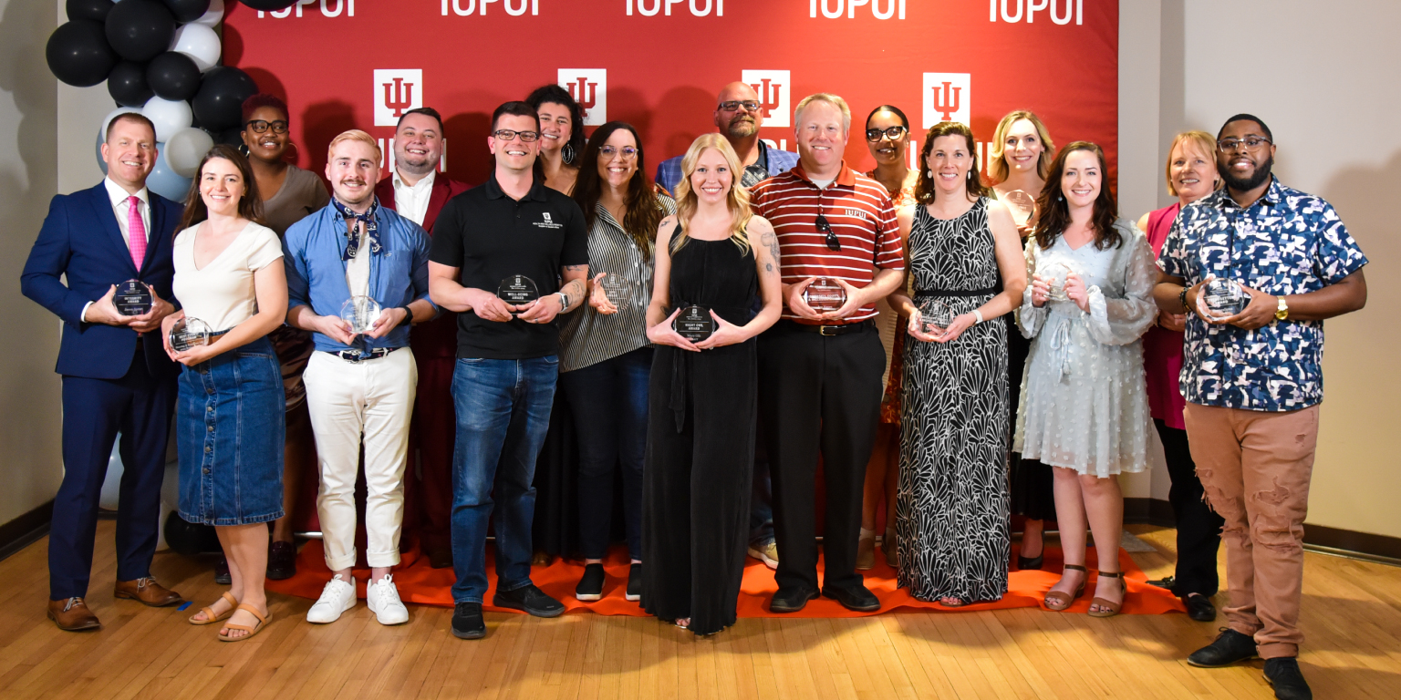 Division of Student Affairs staff members pose with their awards from the year end celebration.