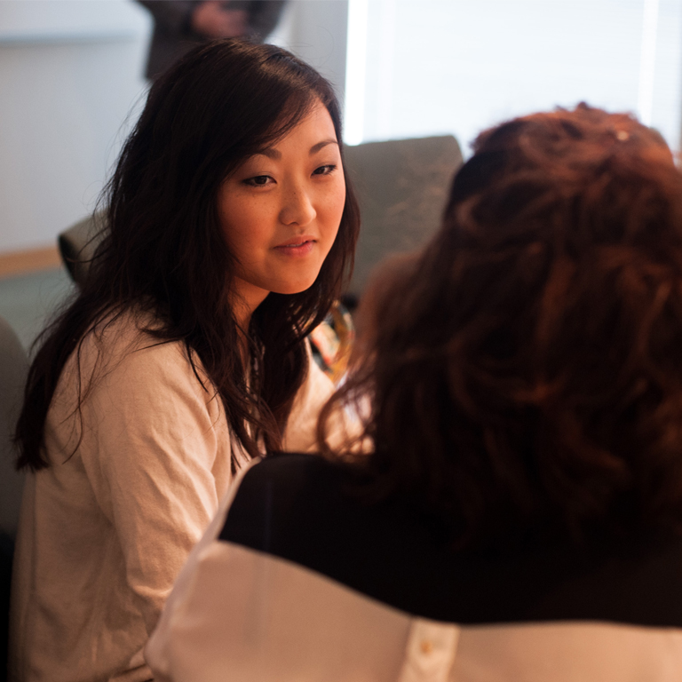 A student talks with another student in the campus center.