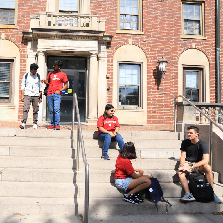 Students hanging out around Ball Hall.